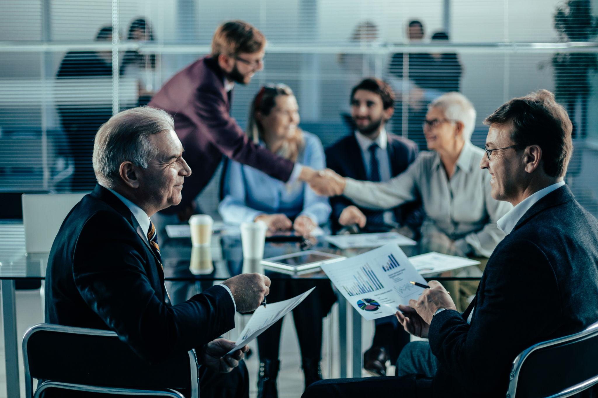 Investment professionals reviewing a business plan